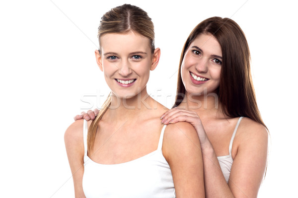 Dois atraente meninas posando sem mangas espaguete Foto stock © stockyimages