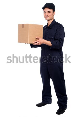Handsome young man with with stack of boxes Stock photo © stockyimages