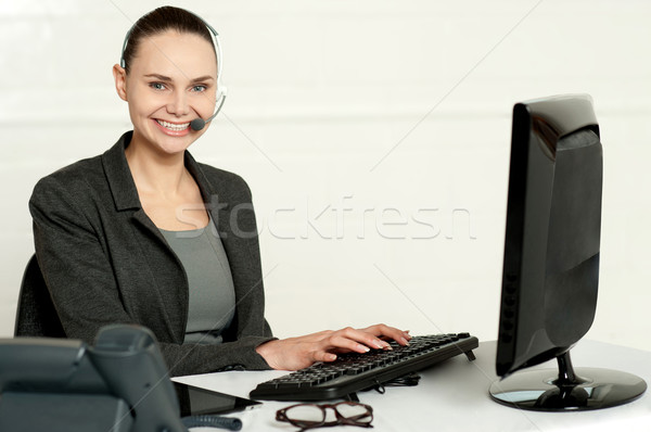 Female employee assisting customers Stock photo © stockyimages