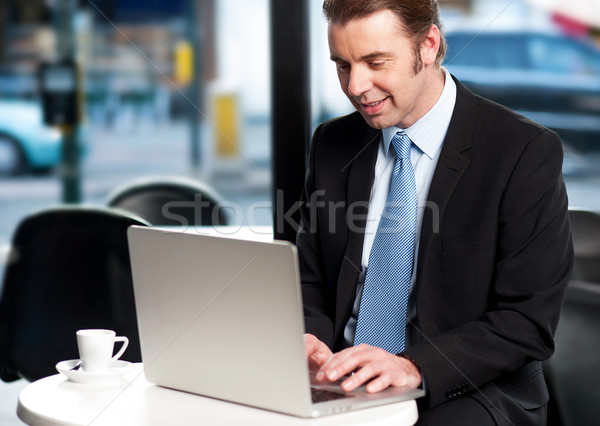 Work on the move. Businessman working Stock photo © stockyimages