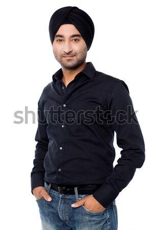 Young isolated Indian guy posing casually Stock photo © stockyimages