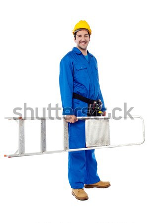 Young repairman ready with stepladder Stock photo © stockyimages
