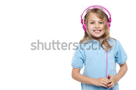 Pretty young girl enjoying music Stock photo © stockyimages