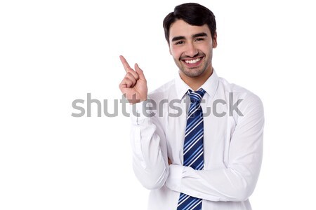 Uśmiechnięty kierownik wskazując wstecz biznesmen kopia przestrzeń Zdjęcia stock © stockyimages