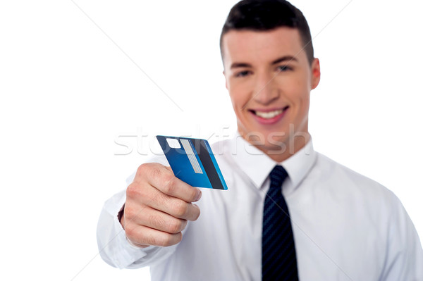 Businessman displaying his cash card Stock photo © stockyimages