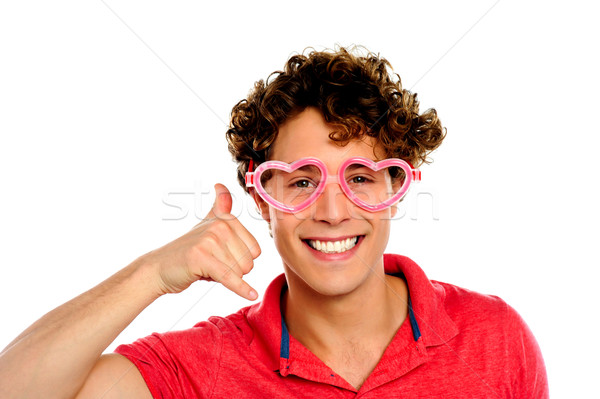 Boy posing with heart shape eye-wear Stock photo © stockyimages