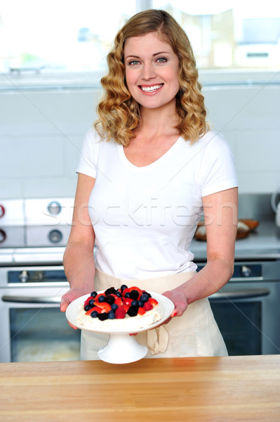 Attractive female presenting yummy treat Stock photo © stockyimages