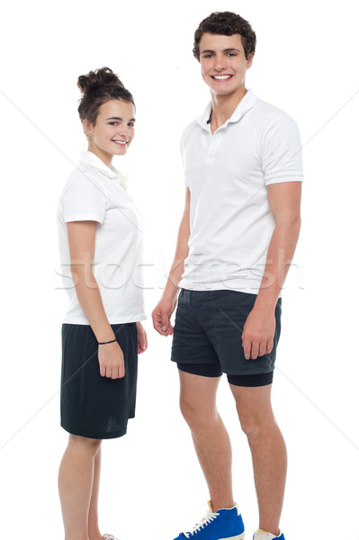 Teen couple in sportswear posing casually Stock photo © stockyimages