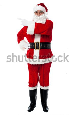 Santa showing newly launched tablet pc Stock photo © stockyimages