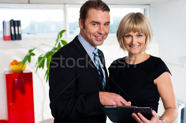 Stock photo: Corporate couple reviewing weekly schedule