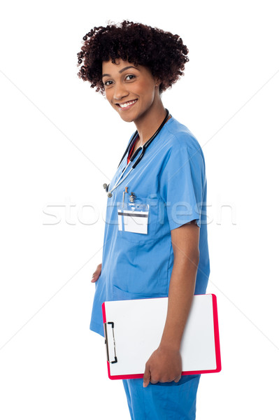 Sorridente médico profissional clipboard Foto stock © stockyimages