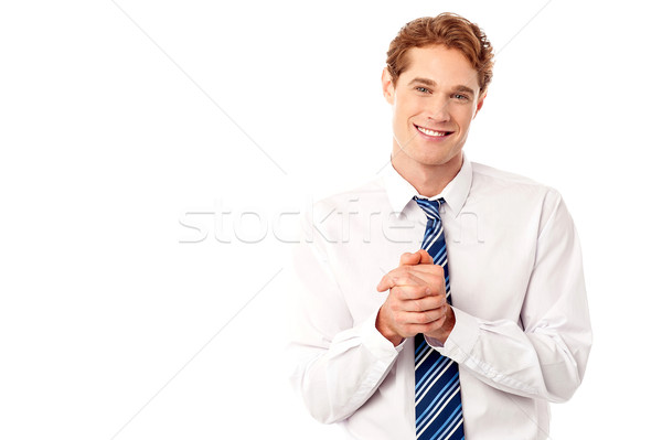 Corporate guy posing with clasped hands Stock photo © stockyimages