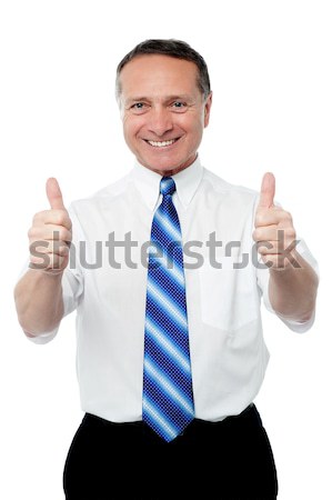 Entrepreneur showing double thumbs up Stock photo © stockyimages