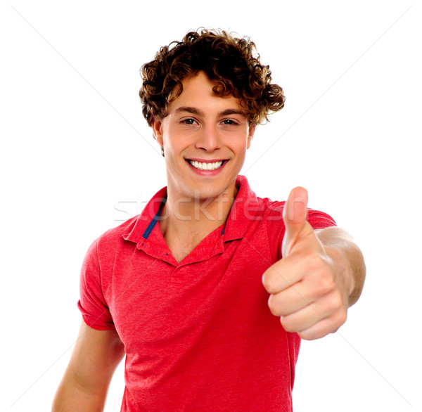 Jóképű fiatalember gesztikulál izolált fehér mosoly Stock fotó © stockyimages