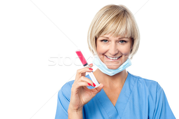 Female surgeon ready with an injection Stock photo © stockyimages