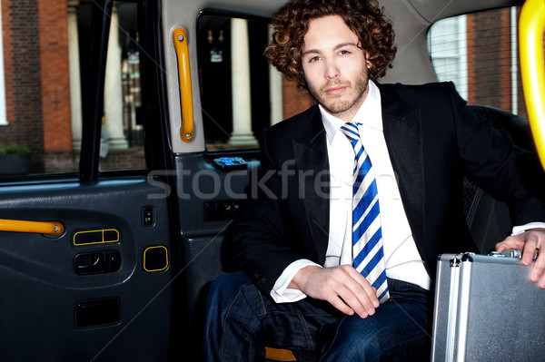 Handsome business corporate inside taxi cab Stock photo © stockyimages