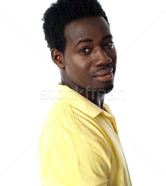 Young african guy posing in casuals Stock photo © stockyimages