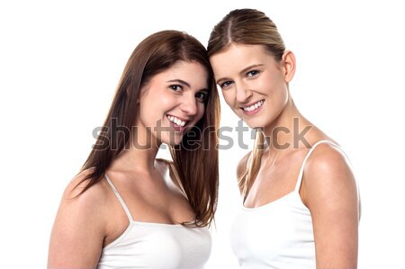 Two attractive girls posing in sleeveless spaghetti Stock photo © stockyimages
