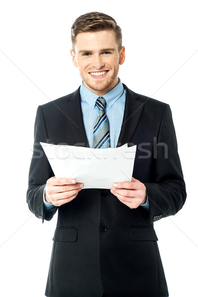 Businessman holding important deal documents Stock photo © stockyimages