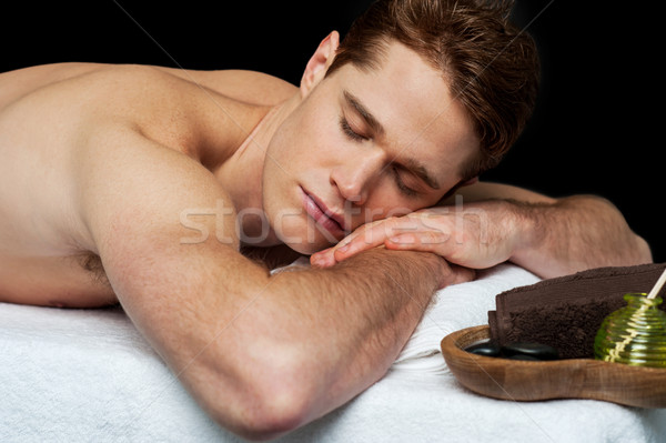 Handsome man relaxing at the spa Stock photo © stockyimages