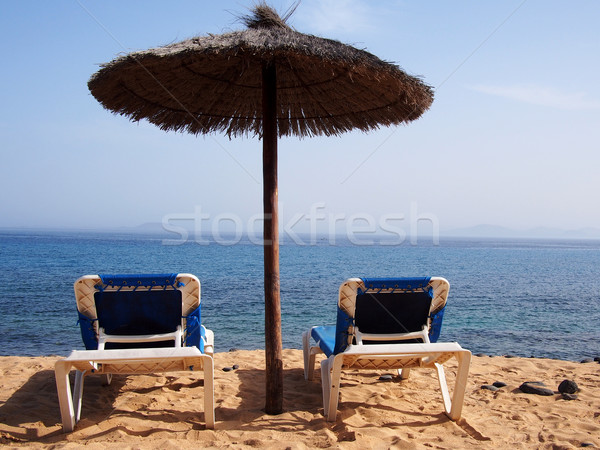 Sand beach with chairs Stock photo © stockyimages