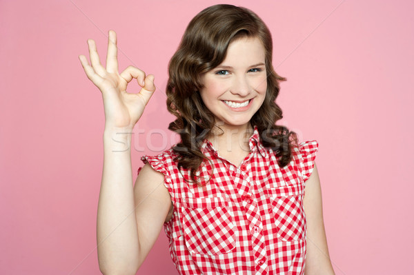 привлекательный улыбаясь подростку вызывать знак Сток-фото © stockyimages
