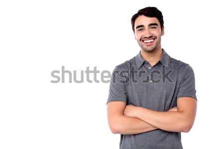 Handsome young cheerful guy in casual clothes Stock photo © stockyimages