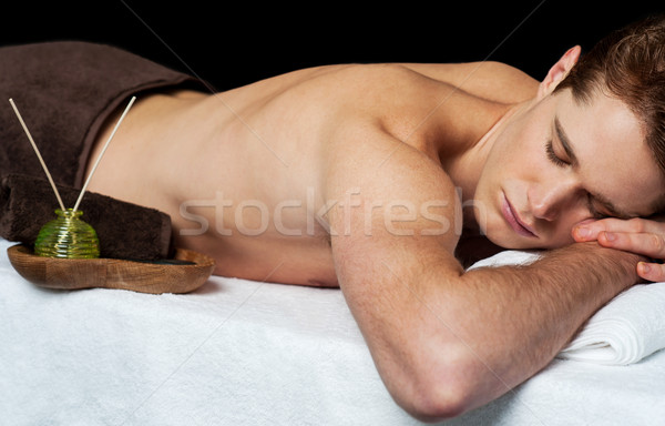 Young man in spa massage salon Stock photo © stockyimages