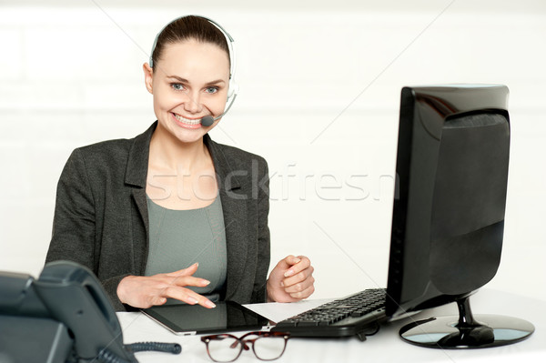 Customer care executive using tablet pc Stock photo © stockyimages