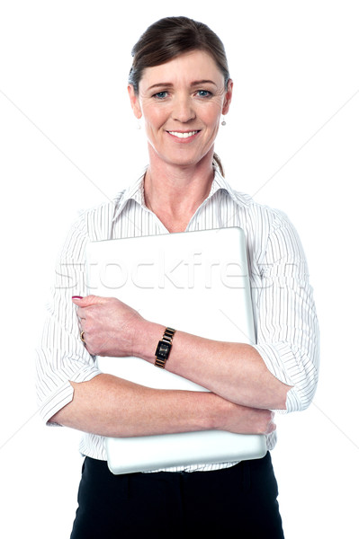 Női igazgató tart laptop vállalati mosolyog Stock fotó © stockyimages