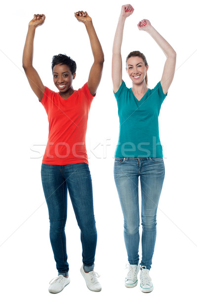 Lelkes csinos nők nők karok felfelé Stock fotó © stockyimages