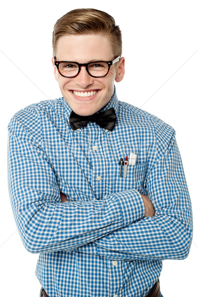 Mischievous young man posing smartly Stock photo © stockyimages
