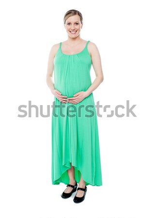 Bruneta femeie gravida ca prinţesă verde Imagine de stoc © stockyimages