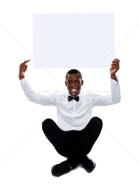 Man pointing towards blank billboard. Copyspace Stock photo © stockyimages