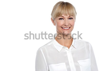 Stock photo: Cheerful confident business executive posing