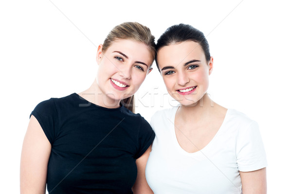 Young smiling girls looking at you Stock photo © stockyimages