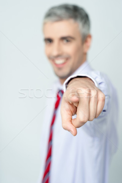 Handsome businessman pointing at you Stock photo © stockyimages