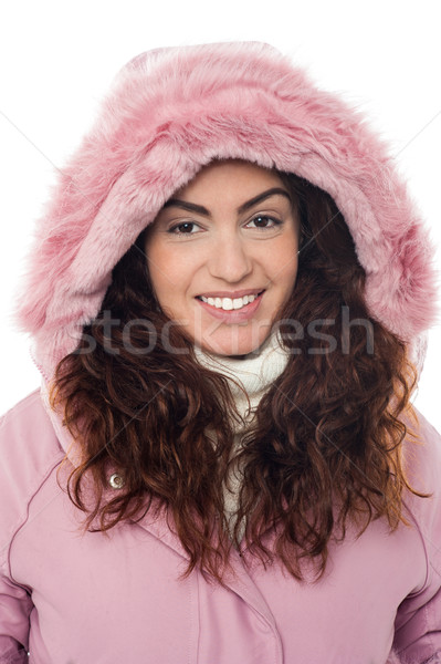Permed hair woman wearing pink hood winter jacket Stock photo © stockyimages