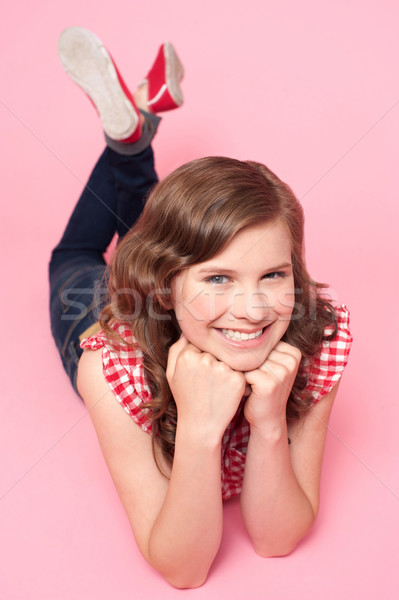 Beautiful girl posing with hands on chin Stock photo © stockyimages