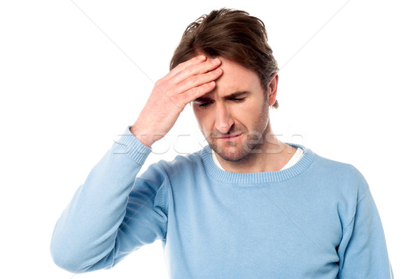Man having severe headache Stock photo © stockyimages