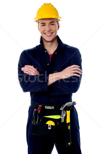 Smiling handyman isolated over white Stock photo © stockyimages