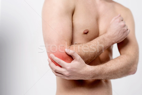 Człowiek łokieć mężczyzna ból wspólny czerwony Zdjęcia stock © stockyimages