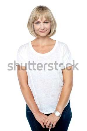 Shy woman in casuals Stock photo © stockyimages