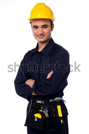 Mosolyog építőmunkás citromsárga védősisak jóképű visel Stock fotó © stockyimages