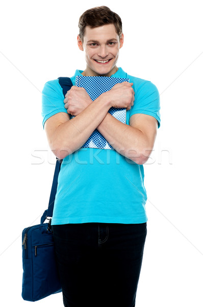 Guy hiding important business document tightly Stock photo © stockyimages