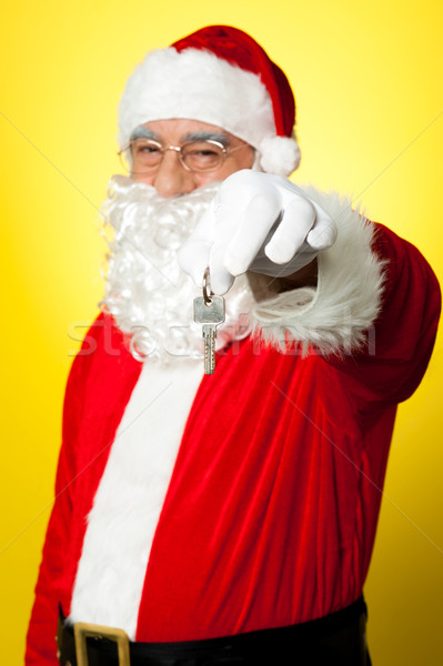 Aged Santa dangling a key Stock photo © stockyimages