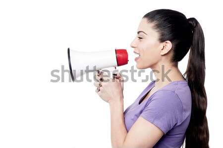 Business woman posing with megaphone Stock photo © stockyimages