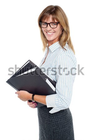 Female executive posing with hands on her waist Stock photo © stockyimages