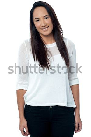 Attractive young casual woman smiling Stock photo © stockyimages