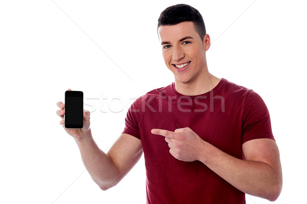 Sonriendo hombre teléfono móvil joven marca Foto stock © stockyimages